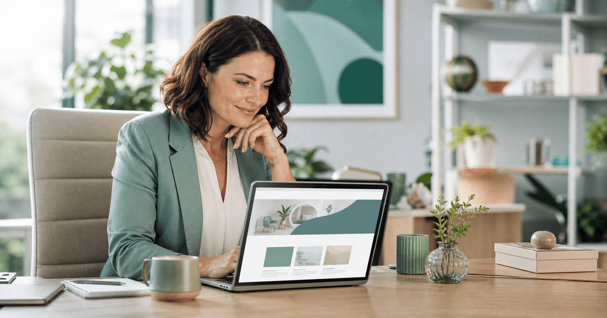 A business owner reviewing a new website design on a laptop