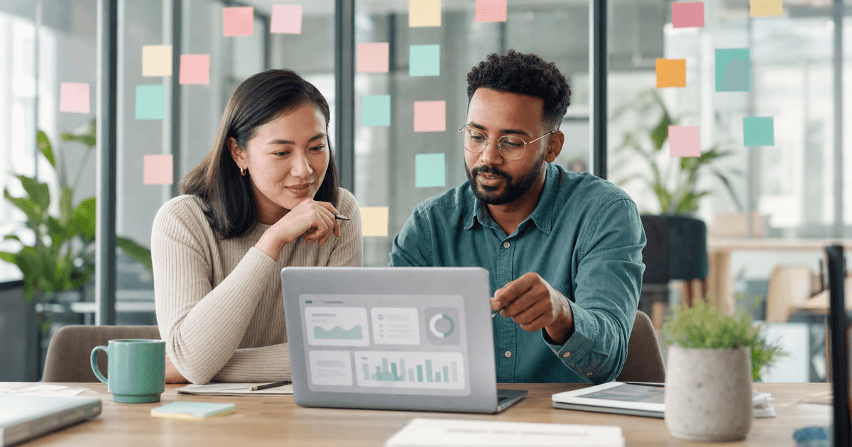 A product team planning an AI feature and its budget on a laptop