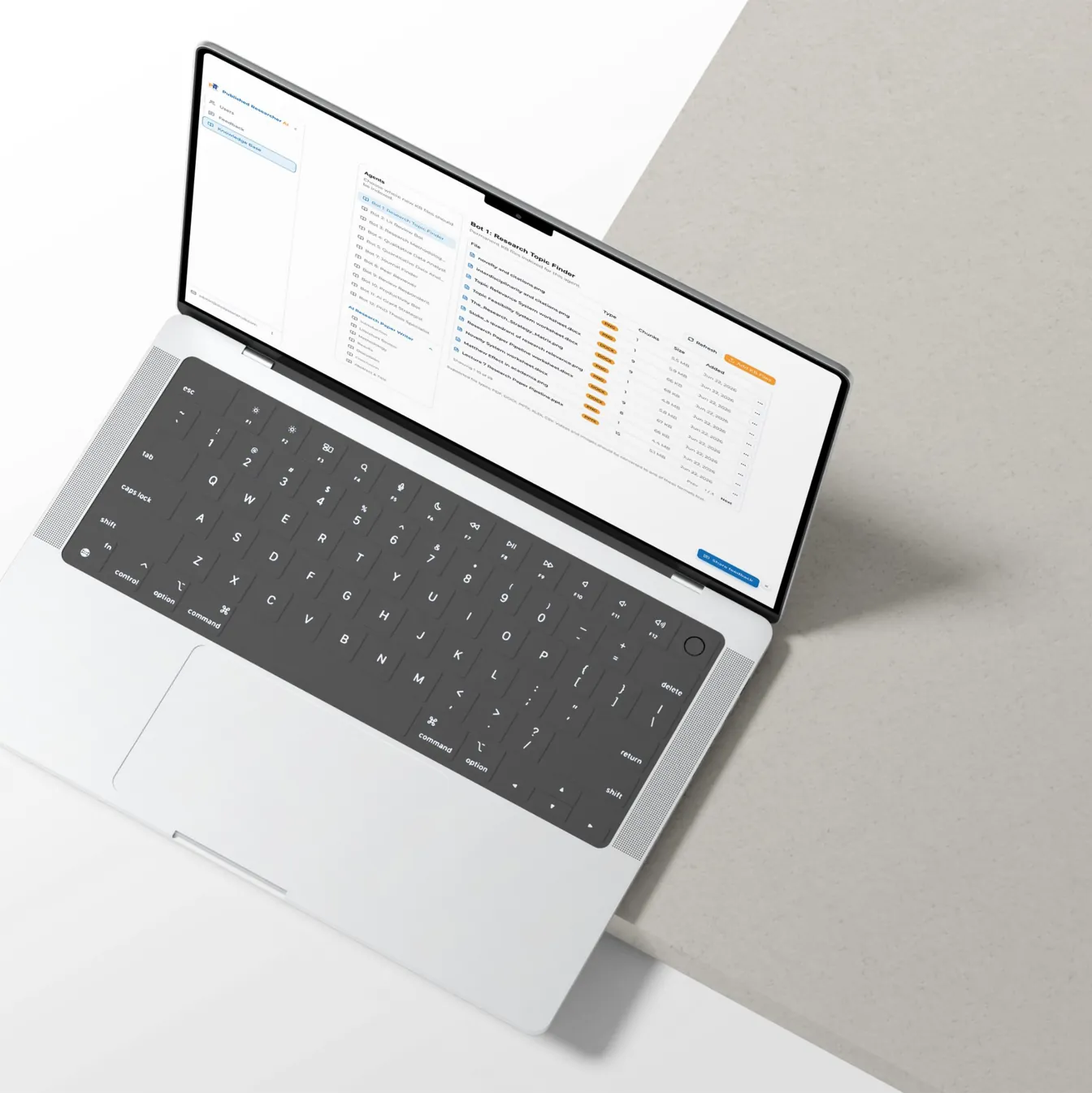 Knowledge base file list for an AI agent on an open laptop, top-down view
