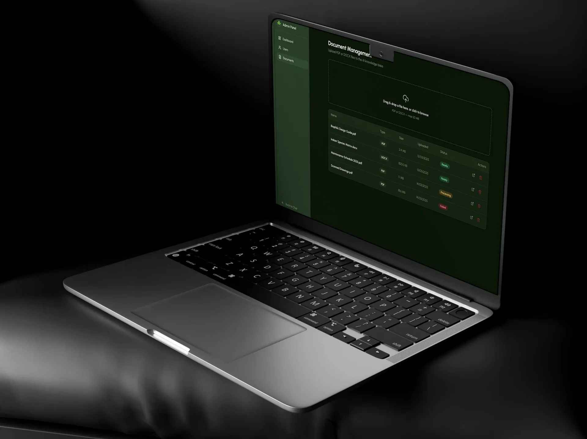 Laptop showing the admin document management screen with an upload area and file list