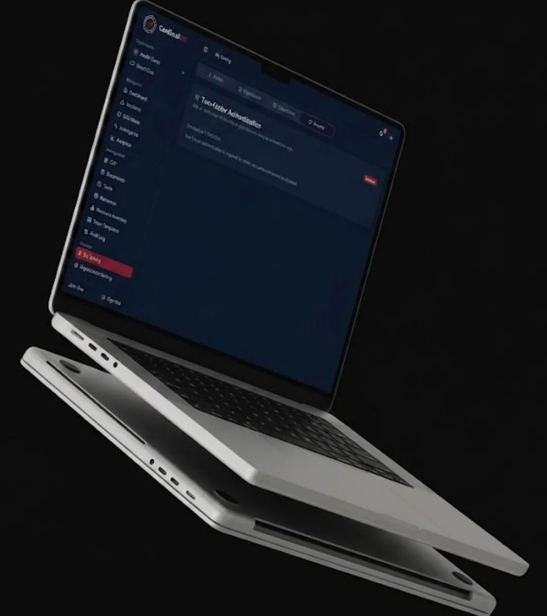 Two-factor authentication settings on a tilted laptop against a black background