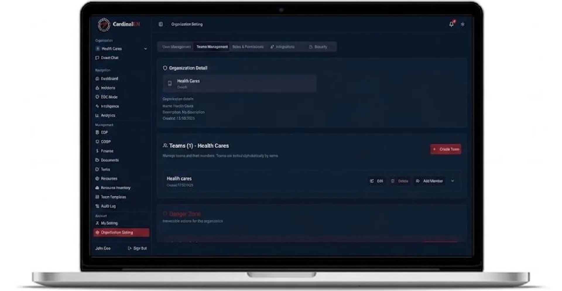 Organization settings with team management in a dark incident-command dashboard on a laptop