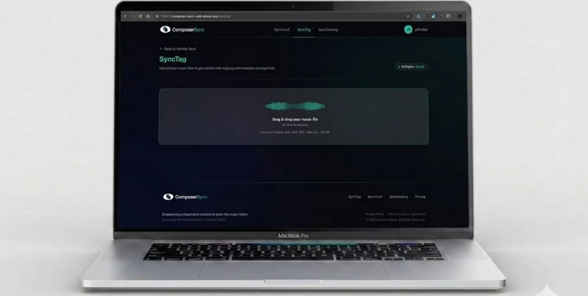 Drag-and-drop audio upload screen on a laptop