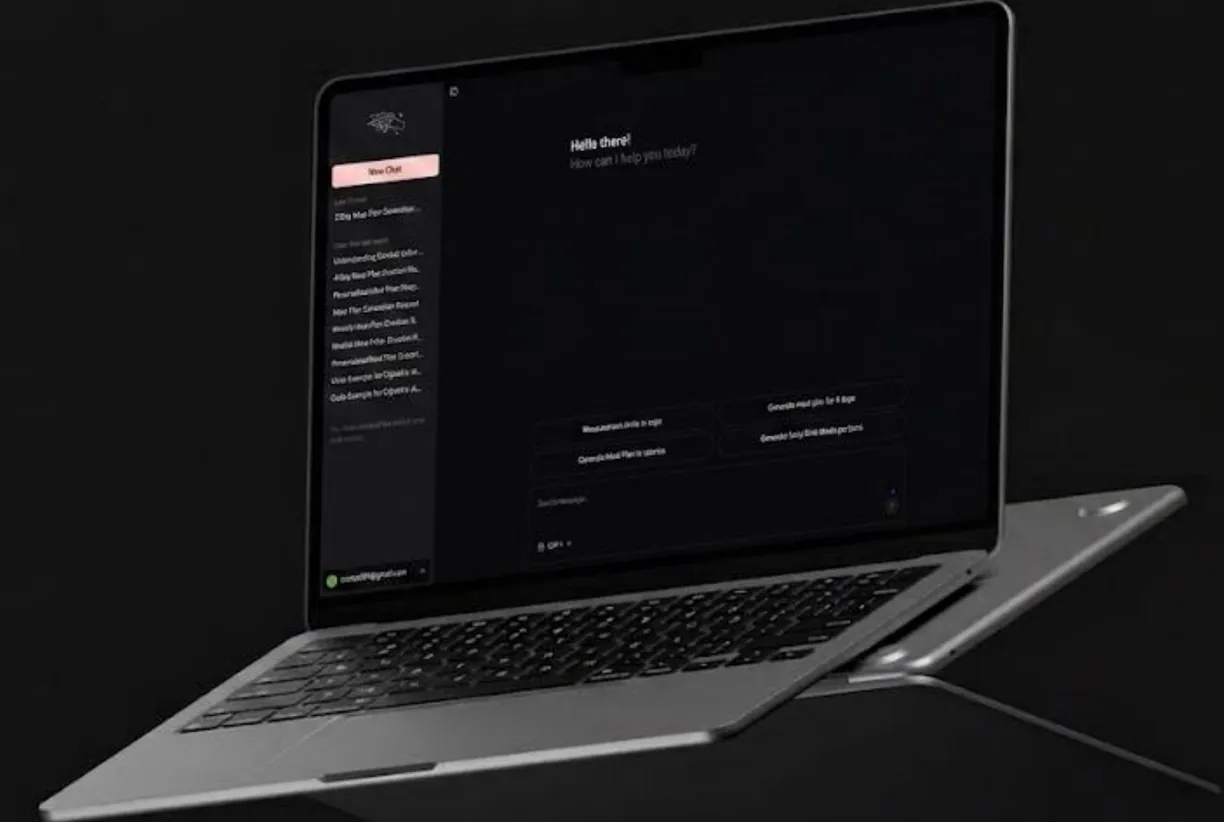 Laptop showing a dark chat home screen with suggested meal-plan prompts