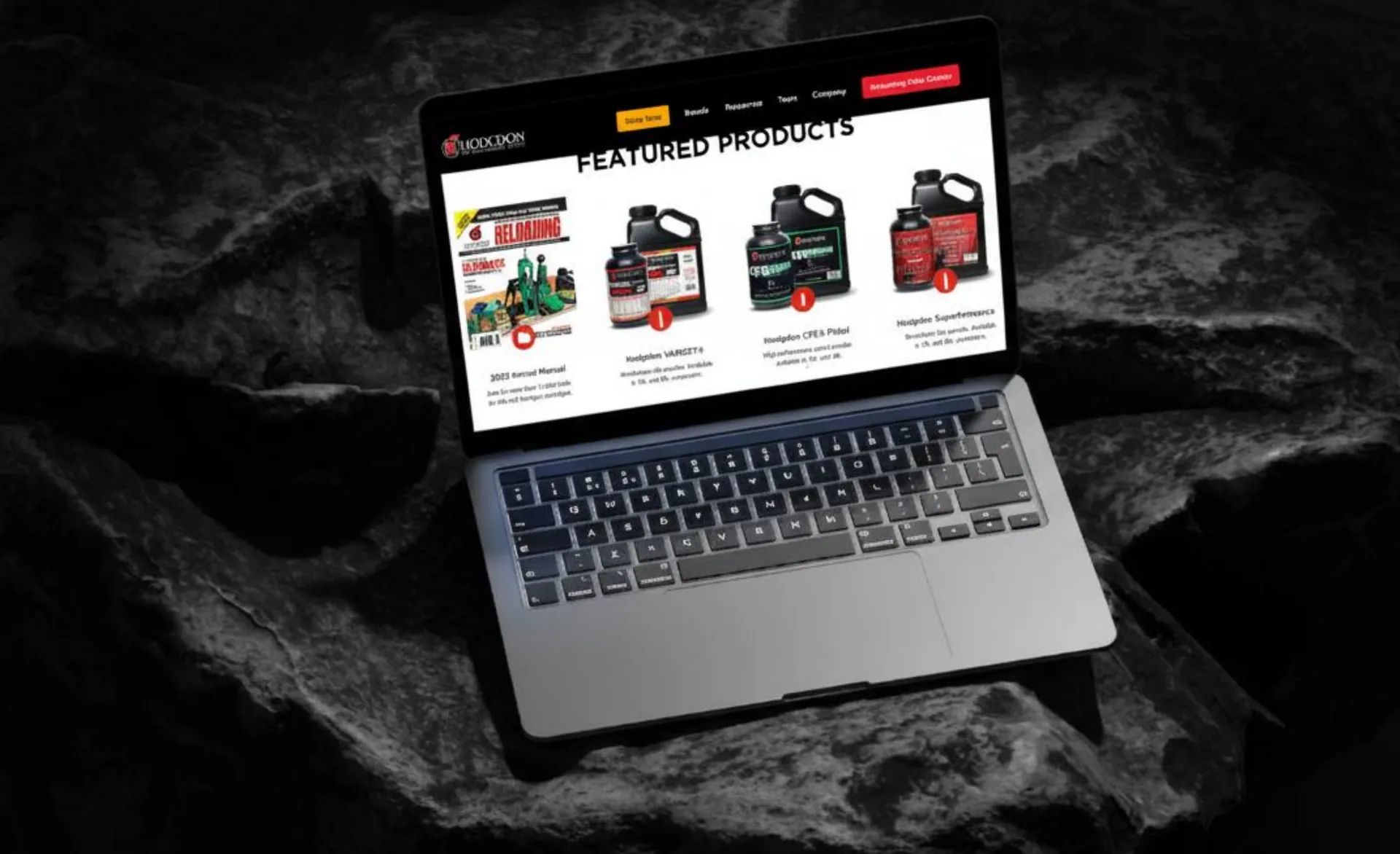 Laptop on dark rock showing a featured products page for reloading powders