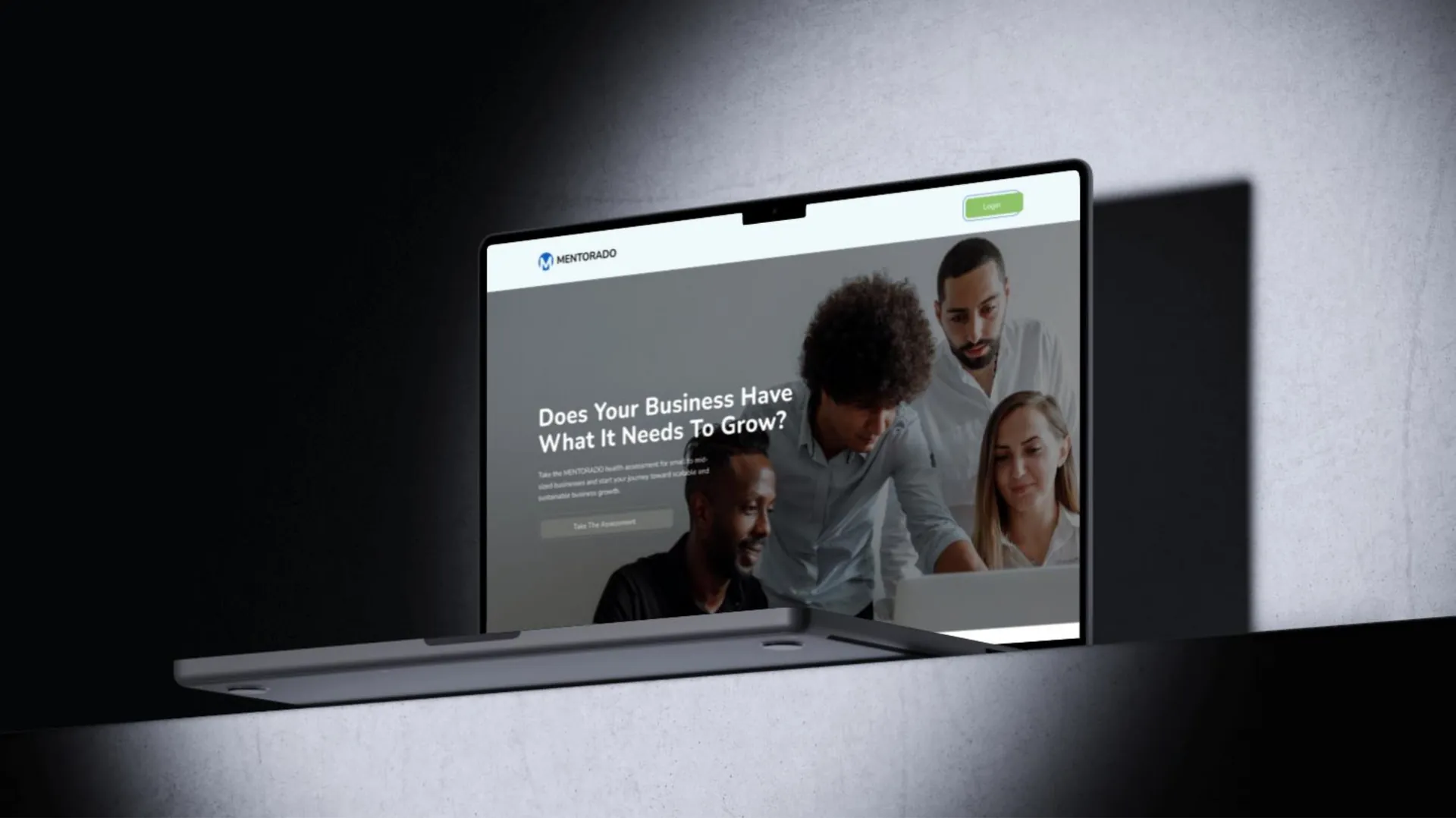 Laptop on a ledge showing a landing page that asks whether a business has what it needs to grow