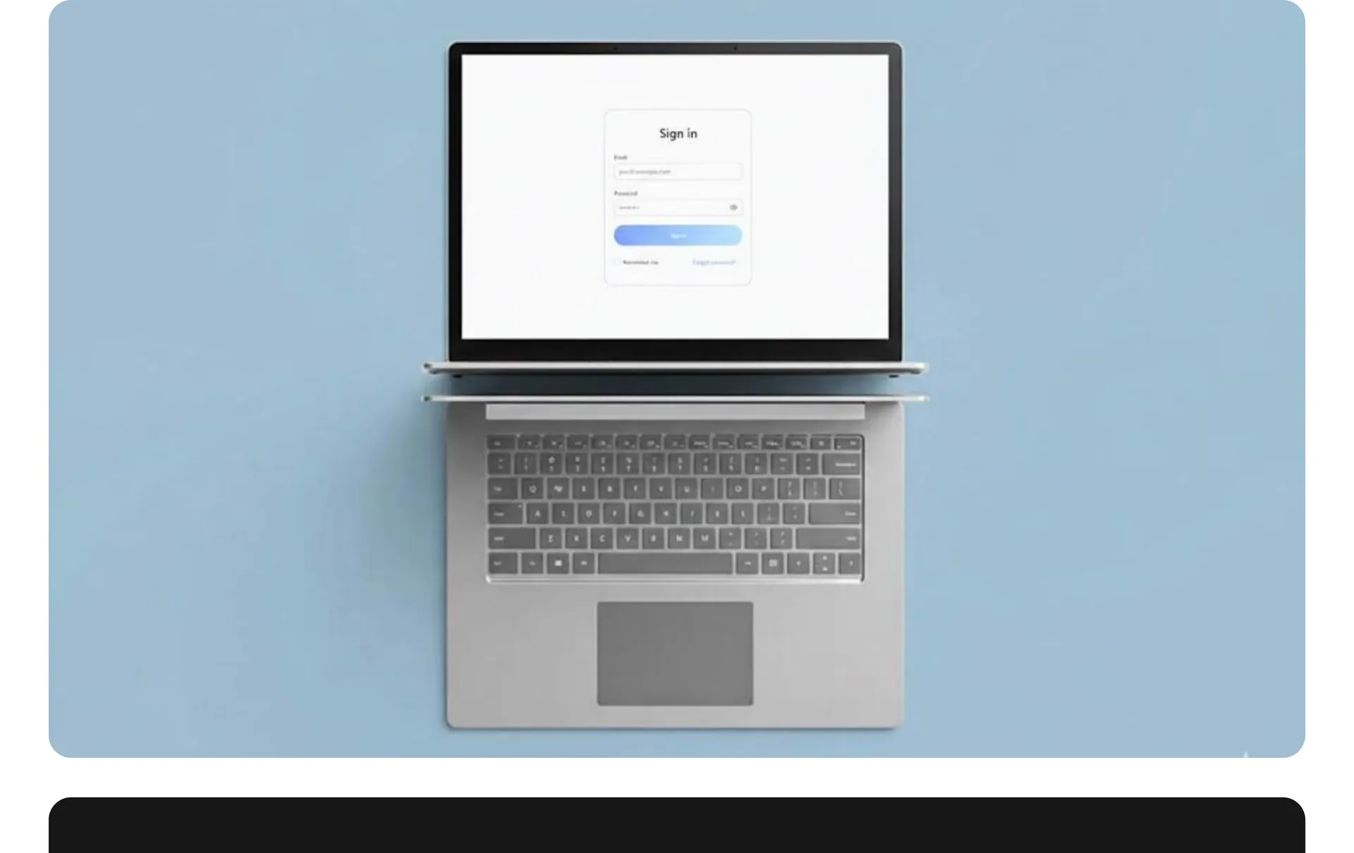 Laptop on a blue background showing a sign-in screen