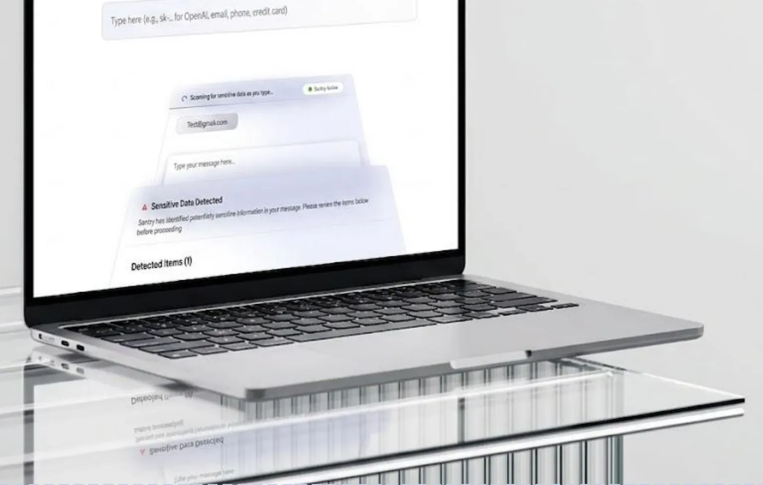 Laptop showing a live demo flagging sensitive data detected in a message