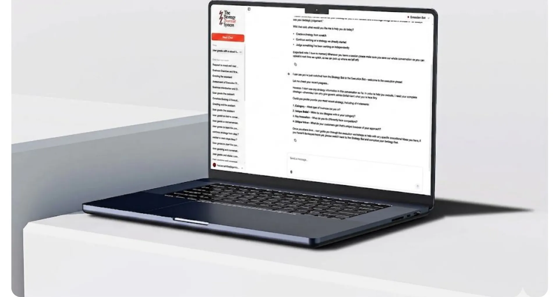 Laptop on a white plinth showing a long coaching chat conversation
