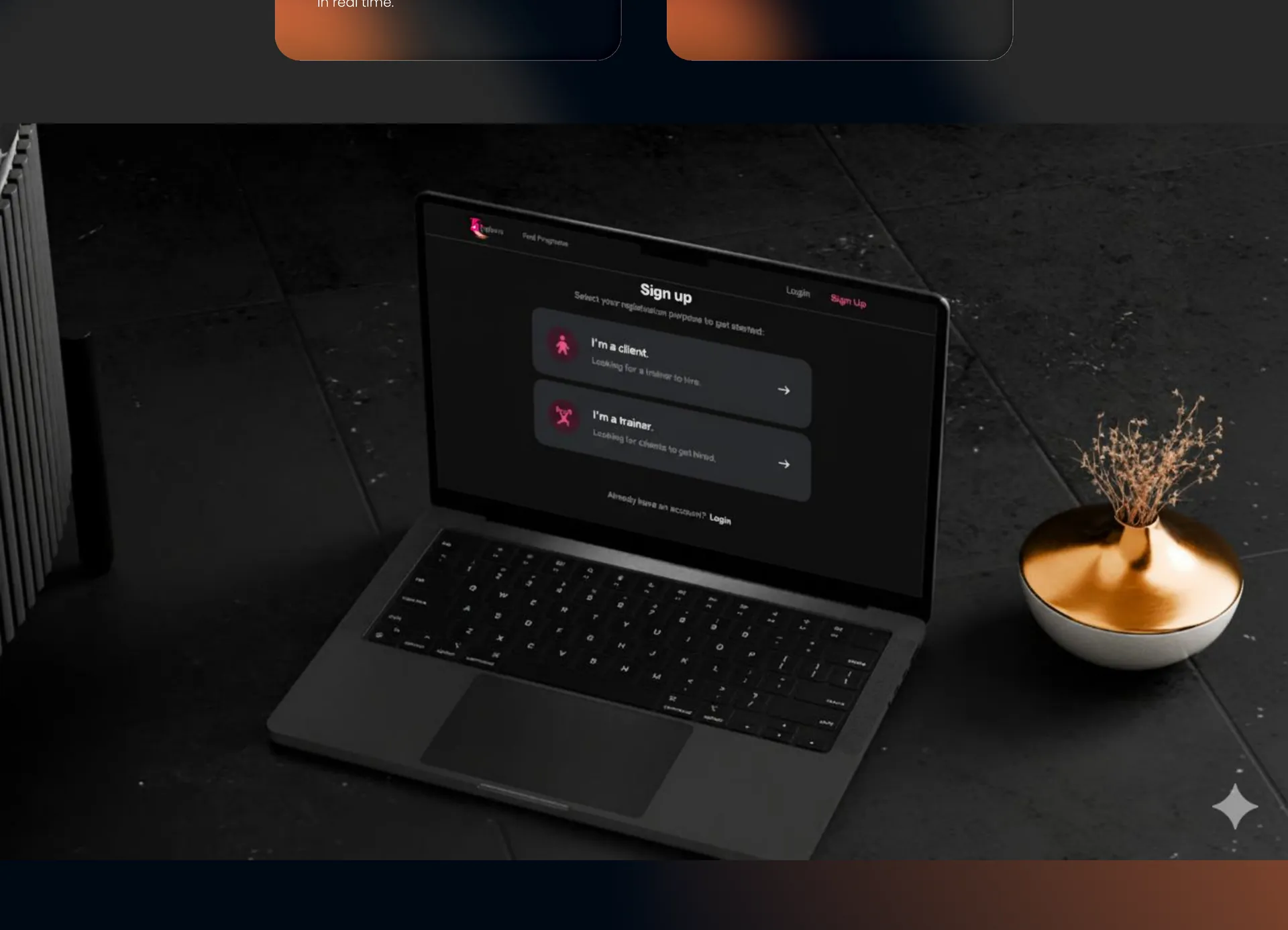 Laptop showing a sign-up screen where users choose between a client and a trainer account